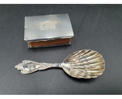 A Victorian silver Caddy Spoon with shell bowl and ornate stem engraved initials, London 1868, and a  silver Matchbox Holder,