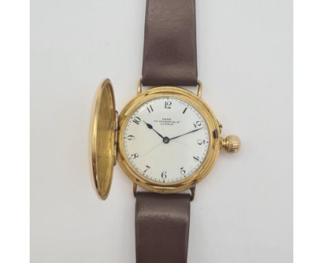 A Victorian 18ct gold cased Hunter Wristwatch by Dent, 33 Cockspur Street, London, No 31457,  the white enamel dial with arab