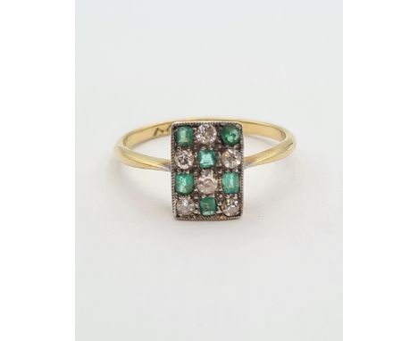 An Art Deco Emerald and Diamond Ring the rectangular plaque millegrain-set chequerboard effect step-cut emeralds and old-cut 