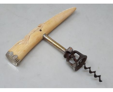 A Williamson's Bell Cap and Cutter style straight pull Corkscrew, with stag antler handle with carved crocodile decoration an