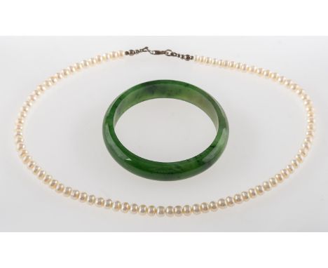 A jade bangle and a pearl necklace, a small jade bangle, inner diameter approx. 5.5cm, 34.2grams; and a freshwater pearl neck