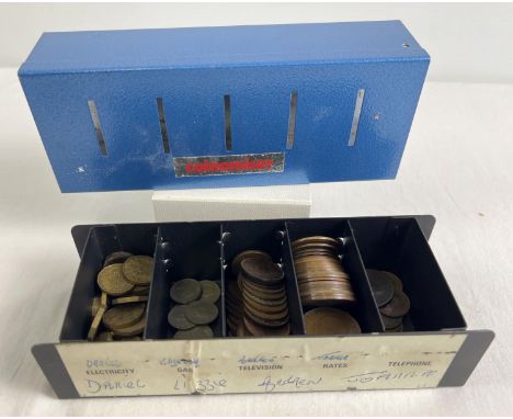 A vintage Coinomiser cash tin containing pre decimal coins to include pennies, half pennies, three pence coins, sixpences, Fa