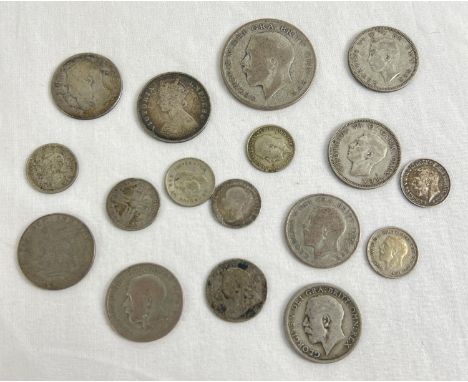 A collection of vintage and antique coins to include silver examples. Lot includes a George V half crown, 6 x shillings, 5 x 