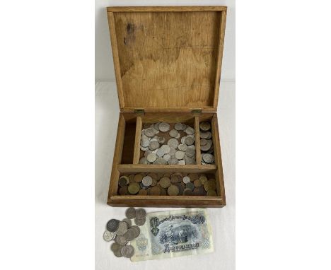 A vintage wooden box of assorted foreign coins and a Bulgarian banknote. To include currency from France, Netherlands, Malta,