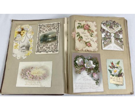 A vintage album of assorted Victorian &amp; Edwardian greeting cards (stuck in). 