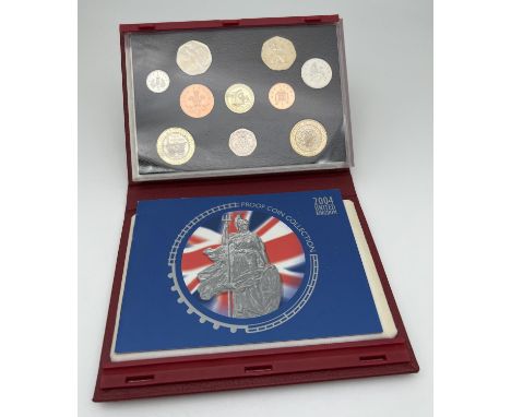 A cased set of Royal Mint 2004 proof coins with information booklet. To include 200 yrs of the steam engine Â£2 coin, Standin