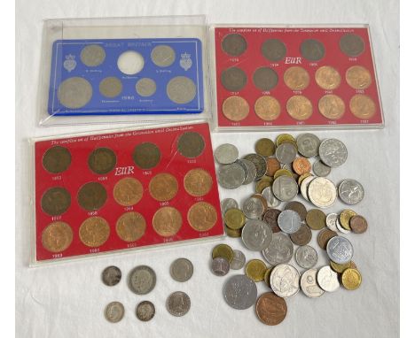 A collection of British and foreign vintage coins. To include Elizabeth II cased sets of halfpennies, 2 x 1916 silver three p