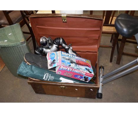 A metal trunk and contents to include skateboards, rocky lobster, robot etc