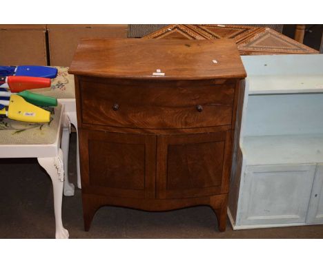 A bow fronted commode