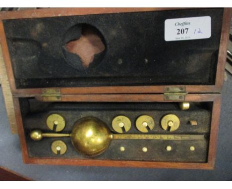 A mahogany cased hydrometer together with a cased set of scales with glass pans  