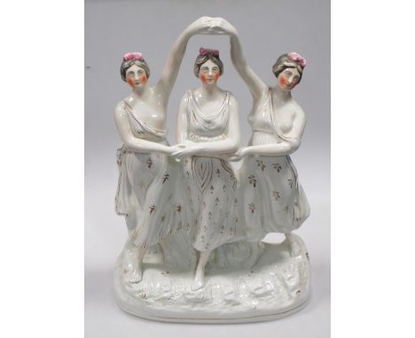 A 19th century Staffordshire group of three dancing ladies, 39cm high  Hairline to the base but not visible I  think its more