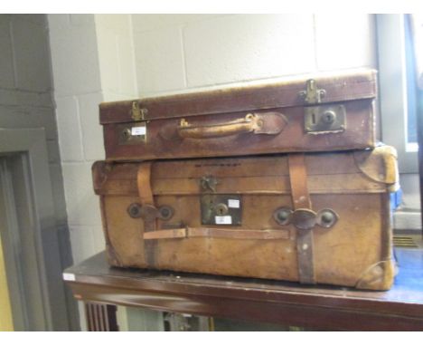 A leather trunk and a vellum suitcase (2)  