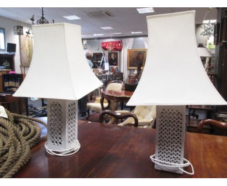 Four cream 20th century ceramic lamps and shades, stamped to base  