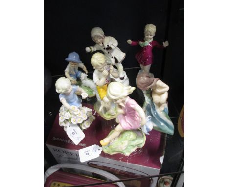 Seven Royal Worcester figures representing the months, modelled by F G Doughty  