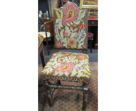 A 17th century oak needlepoint upholstered back stool  