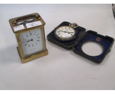 An early 20th century large calendar pocket watch with date, month, day dials and moon phase, in a leather travel case stampe