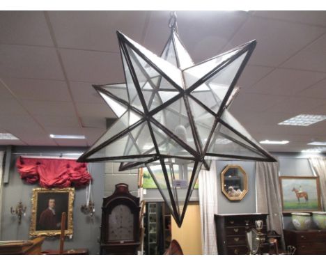 A star shaped hanging ceiling light  