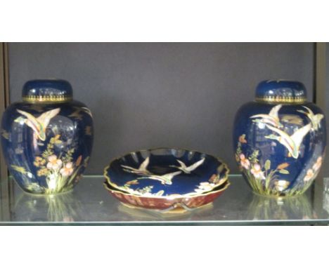 A pair of Carlton ware ginger jars, together with two similar Carlton ware dishes  All pieces in good condition