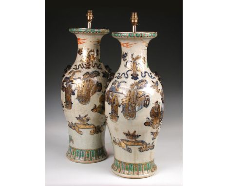 A pair of 19th century Canton baluster vases/lamps, the bronzed mask and ring handles on a crackleware ground above figures p