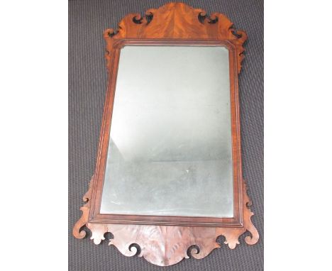 A Chippendale style walnut fret frame wall mirror, 101½ x 58cm (39 x 23in)  