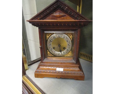An early 20th century mahogany mantel clock striking on a coiled rod  