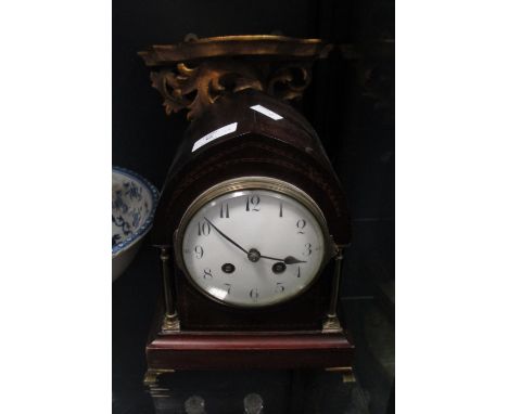 An Edwardian mahogany mantel clock with enamel dial and French gong striking movement together with an Italian giltwood brack