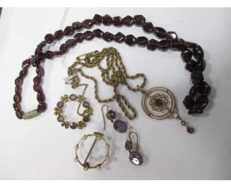 An early 20th century amethyst and seed pearl pendant, on later rope twist chain, an amethyst and seed pearl brooch, a pearl 