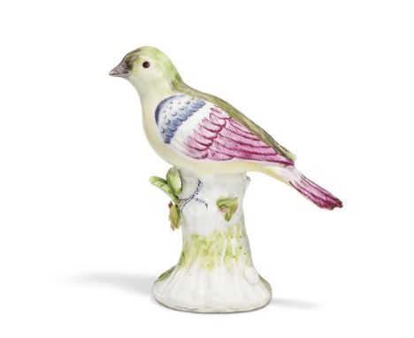 ‡&nbspA CHELSEA PORCELAIN RAISED ANCHOR MODEL OF A FINCH  CIRCA 1750-52 Modelled perched on a tree-stump, his head turned to 