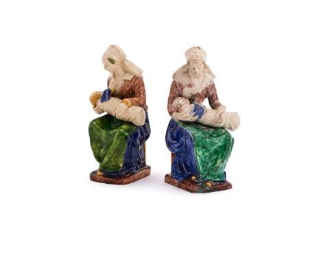 ‡ &nbspA PAIR OF FRENCH EARTHENWARE FIGURES OF 'LA NOURRICE'  FIRST HALF 17TH CENTURY, PROBABLY FONTAINEBLEAU, ATELIER OF CLA