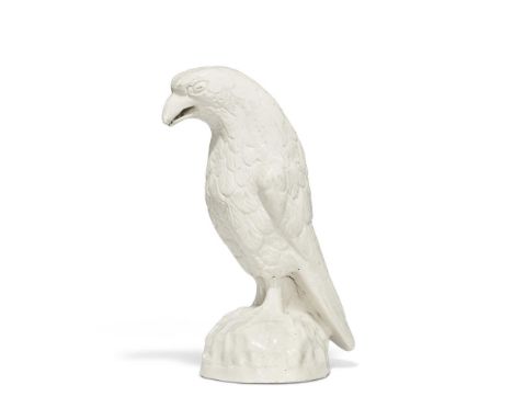 ‡ &nbspA STAFFORDSHIRE WHITE SALT-GLAZED STONEWARE MODEL OF A HAWK  CIRCA 1755  Modelled perched on a rockwork base, collecti