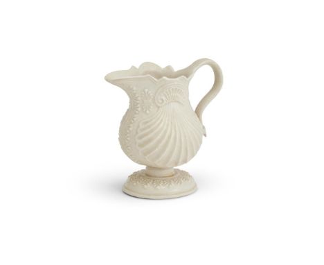 ‡&nbspA STAFFORDSHIRE SALT-GLAZED STONEWARE PECTIN-SHELL CREAM-JUG  CIRCA 1750  Crisply moulded, the foot with acanthus leaf-