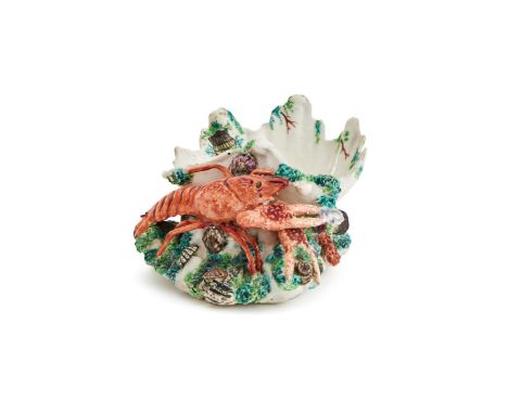 ‡ &nbspA CHELSEA PORCELAIN CRAYFISH SALT  CIRCA 1750-1752  After a silver model by Nicholas Sprimont, modelled as an iron-red