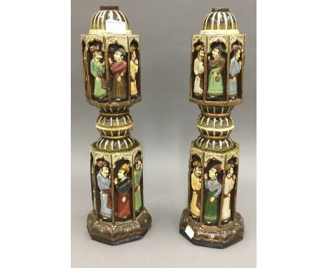 A pair of Eastern carved and painted lamp bases