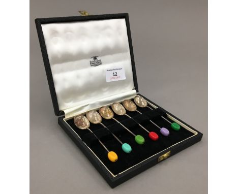 A set of six cased silver coloured coffee bean finial coffee spoons