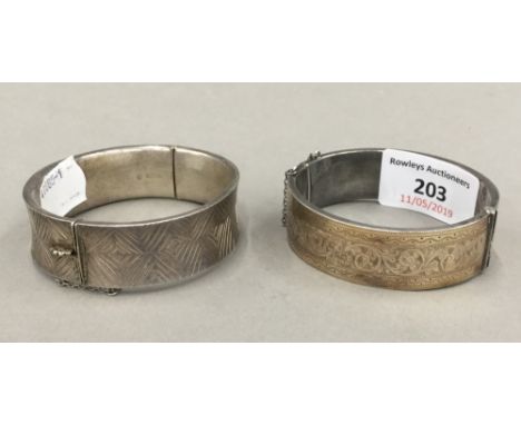 A silver cuff bangle and another (69.1 grammes total weight)