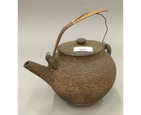A Japanese terracotta teapot