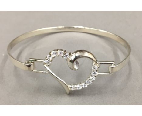 A silver heart bangle