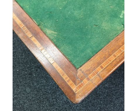 An inlaid mahogany folding card table