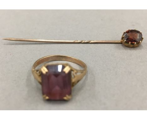 A 9 ct gold stone set ring and a stick pin (3.3 grammes total weight)