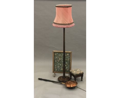 A standard lamp, a foot stool, a tapestry fire screen and a warming pan