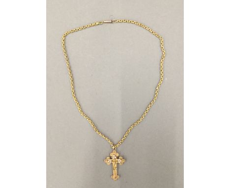 A 9 ct gold and seed pearl cross and chain (9.7 grammes total weight)