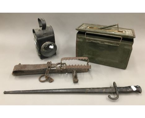 A vintage Light of London lantern together with a period bayonet with sheath, a vintage animal trap and a vintage ammo box
