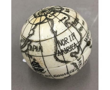 A bone globe compass