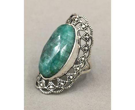 A silver and jade ring