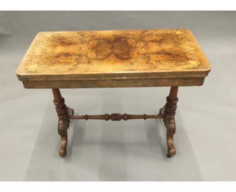 A Victorian inlaid walnut card table