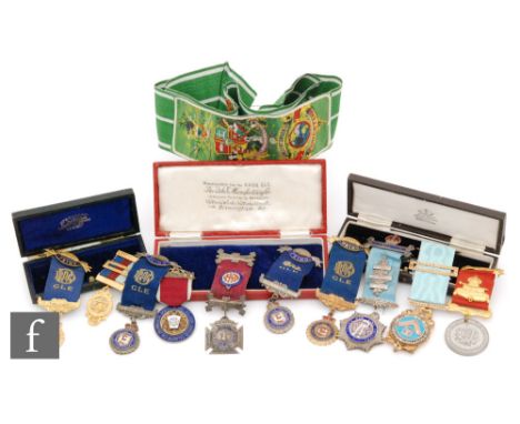 A 19th Century Masonic jewel with enamelled centre and paste set border with ribbon in recognition of service, dated 1877, a 