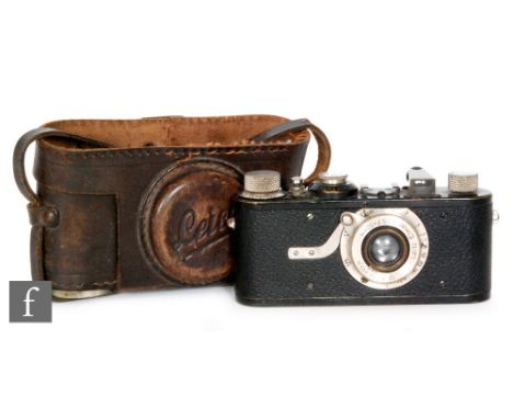 A Leica model 1a camera serial number 32019 with Letz Elmar1:3,5 F=50mm lens in fitted part brown leather case with a cased E