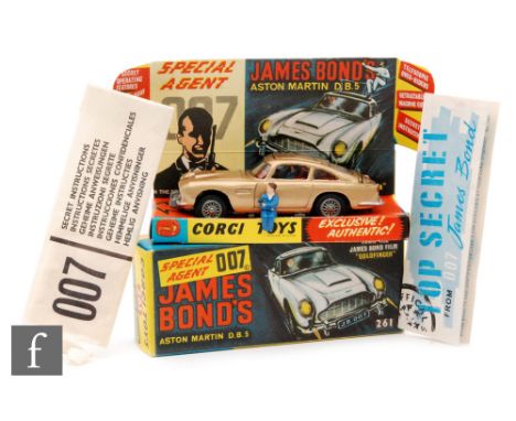 Corgi Toys #261 James Bond 007 'Goldfinger' Aston Martin DB5, with gold body, wire wheels, silver trim and red interior with 