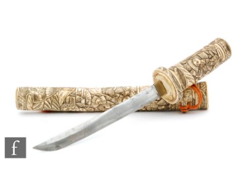 A late 19th Century Japanese bone Wakizashi and scabbard, the sections carved with figures in conversation and holding fans, 