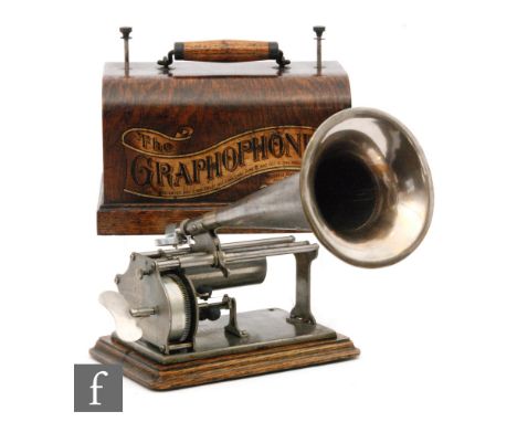 A Graphophone type Q phonograph, key wind operation with reproducer and key with small witches hat type horn, oak case on pli